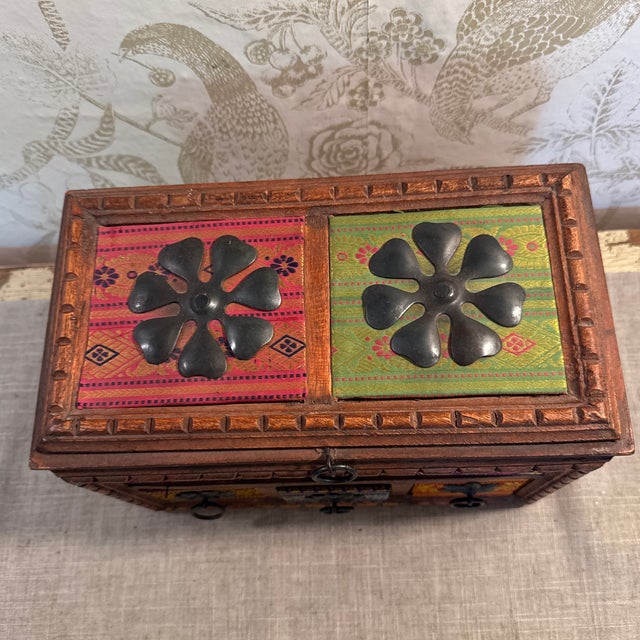Carved wooden with fabric and metal detailing multi- compartment jewelry or storage box- made in India.