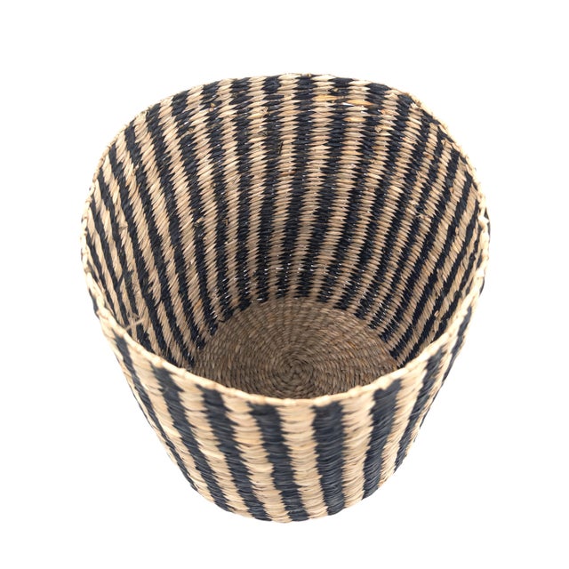 A beautifully handwoven basket crafted in Vietnam, where traditional weaving techniques meet timeless, sculptural form....