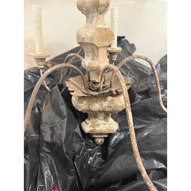 This elegant five-arm chandelier is an Italian piece dating to the 18th century, featuring a beautifully carved wooden...