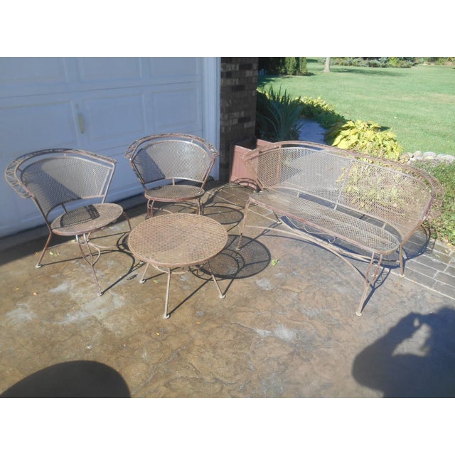 I have a gorgeous 4 piece Vintage Wrought Iron Woodward / Salterini Style Mid Century Outdoor Patio Set. This cute set is...