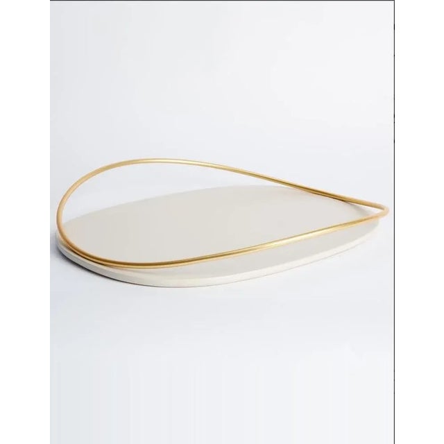 Pair of taupe touché d trays by mason editions dimensions: 36 × 48 × 6.4 cm materials: iron and mdf colors: taupe, cotto,...