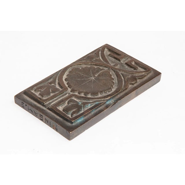 Signed, both sides have been hand tooled, the artist signed on the top edge.