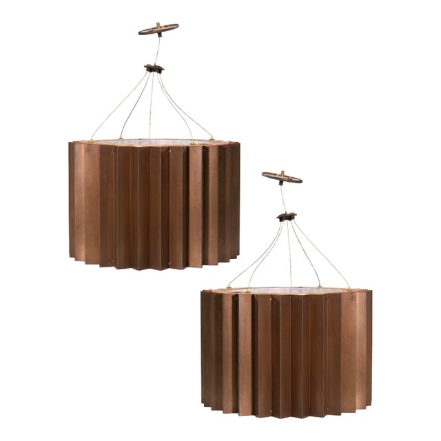 Pair of Michael McEwen "Gear Suspension" Bronze Finished Chandeliers For Sale