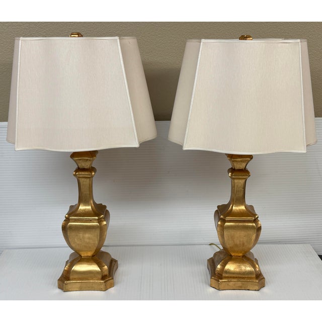 Design Plus Gallery presents a Pair of Giltwood Table Lamps from Baker Knapp & Tubbs. Each lamp has a sculptural giltwood...