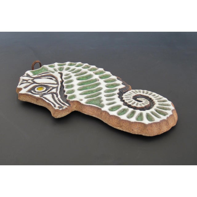 A handmade 1970s terra cotta earthenware seahorse sculpture created by California studio potter Victoria Littlejohn. An...