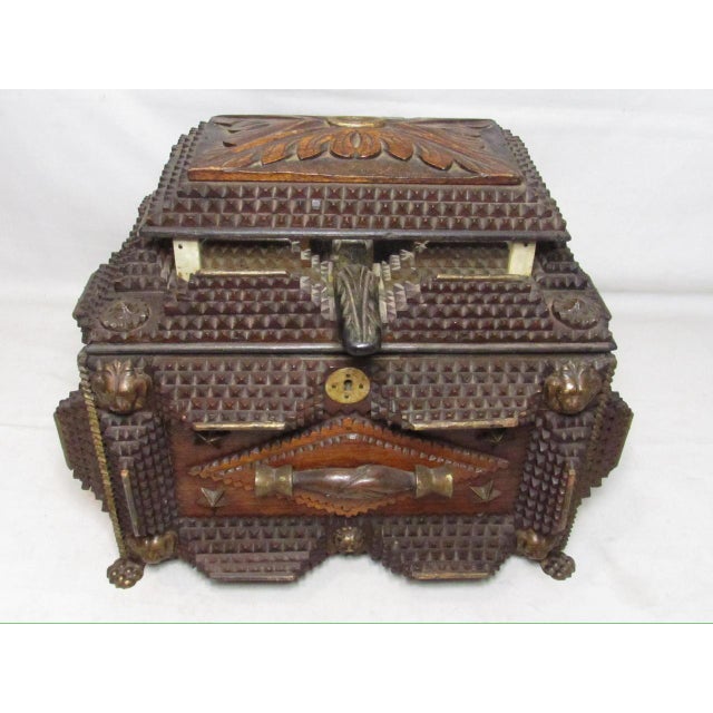 Exceptional quality and condition antique tramp art box, c.1880 A large scale box with a hinged top and standing on lion...