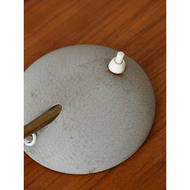 Swedish desk lamp from the 1950s, produced by the EWA company. It features an elegant and minimalist design with a metal...