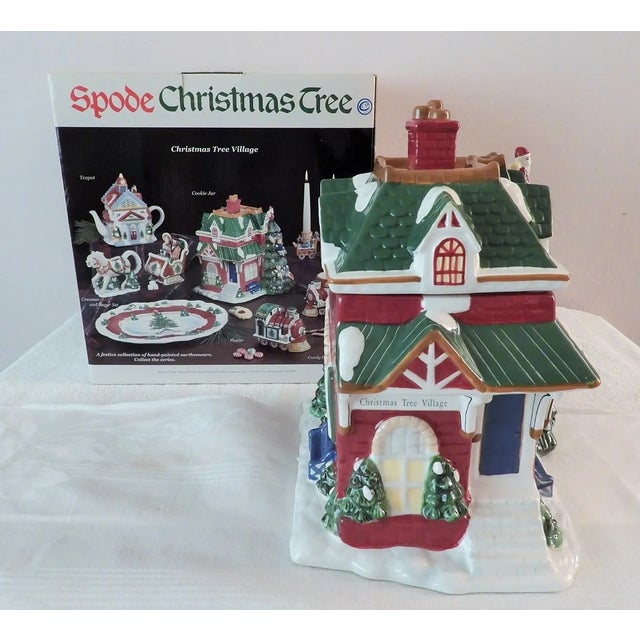 This marvelous Spode Christmas Tree Village Train Station figural cookie jar is created in gorgeous ceramic with red,...
