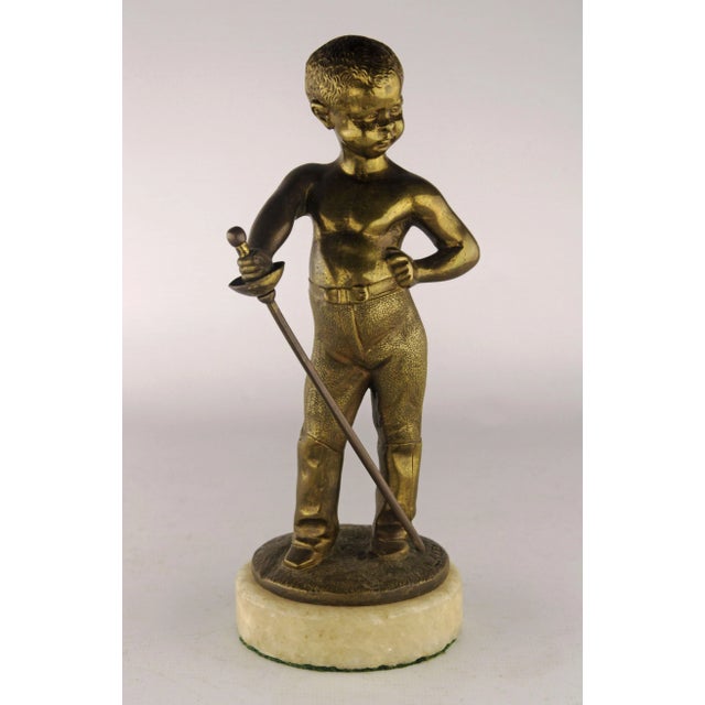 Late 19th century french bronze sculpture of a boy with a sword by Louis Kley By: Louis Kley Material: bronze, alabaster,...