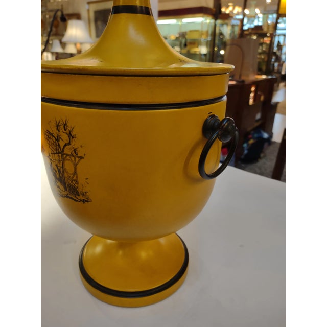 1950s Italian Goldenrod Yellow Tole Ice Bucket with Black Classical Designs. Ring Handles and pine cone finial on lid....