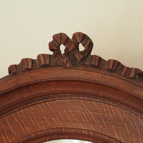 This elegant oak wall mirror, created in 1928, combines its carved frame with a decorative image based on the motif of the...