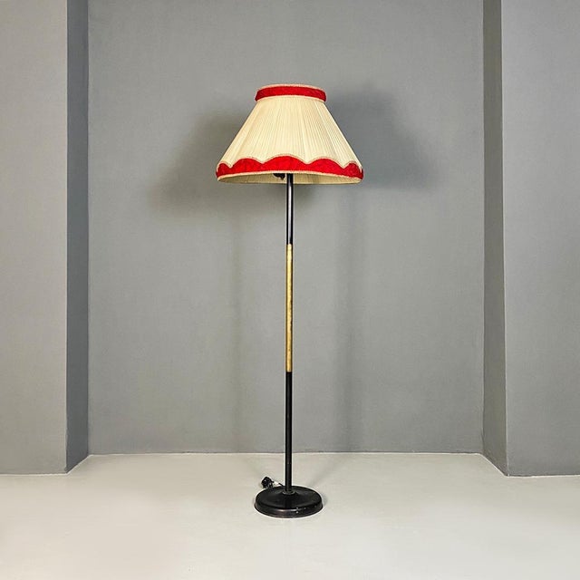 Italian Mid-Century Modern metal, brass and beige and red fabric floor lamp, 1940s. Floor lamp with round base in black...