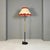 Italian Mid-Century Modern metal, brass and beige and red fabric floor lamp, 1940s. Floor lamp with round base in black...