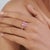 This modern bypass cluster ring features 1.66 carats of oval cut pink sapphires, set in 14K yellow gold. Each sapphire...