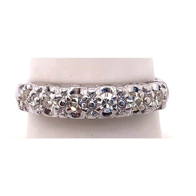 14 Karat White Gold Wedding Band with Diamonds 0.50 Total Diamond Weight. Size 6.5 2.15 grams total weight.
