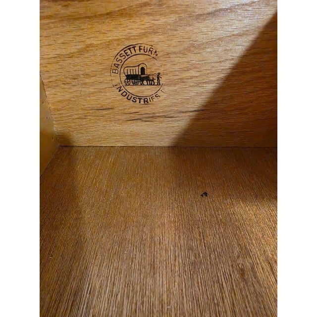 One-of-a-kind Bassett Furniture nightstand, personally refinished in soft white by the seller in 2026. This previously...
