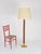 Stunning and unique mid-century floor lamp fully handmade in twisted curved rattan and solid brass, completed by a...