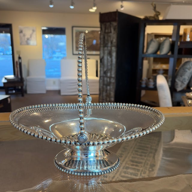 Gorgeous hefty silver plated swing arm beaded edge basket