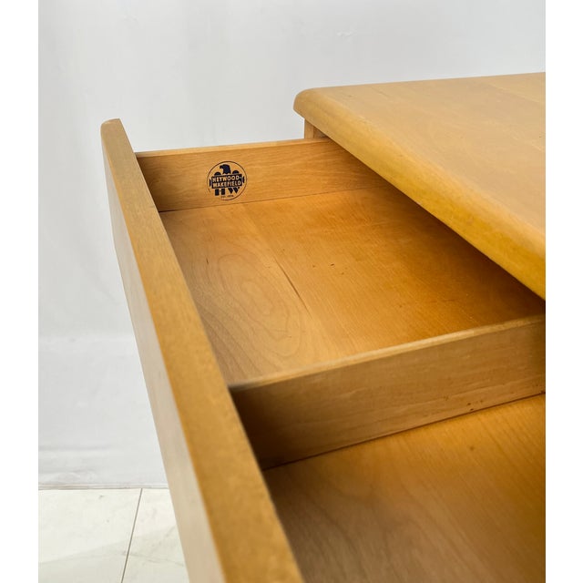 Iconic Mid-Century Modern Heywood-Wakefield executive kneehole desk. Crafted from solid birch with the maker’s signature...