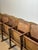Authentic vintage cinema seating consisting of five individual wooden seats mounted on a continuous structural frame. This...