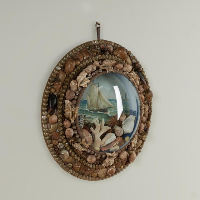 Enchanting 19th century English Sailors valentine handcrafted in exotic seashell lovingly arranged around an image of a...