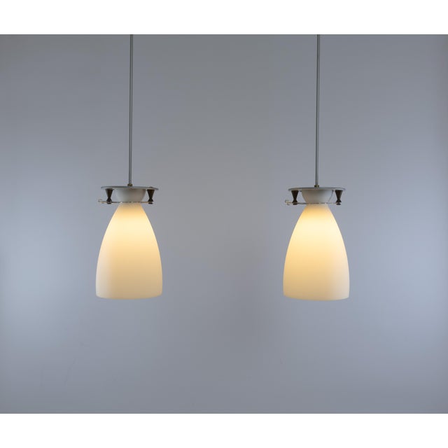 Pair of Franceschina pendants designed by Umberto Riva in 1989 and manufactured by Fontana Arte. The diffuser is made of...