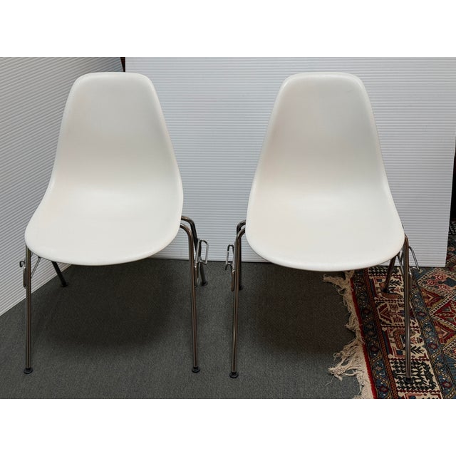 Design Plus Gallery presents a Pair of the Eames Molded Plastic Side Chairs by Charles and Ray Eames for Herman Miller....