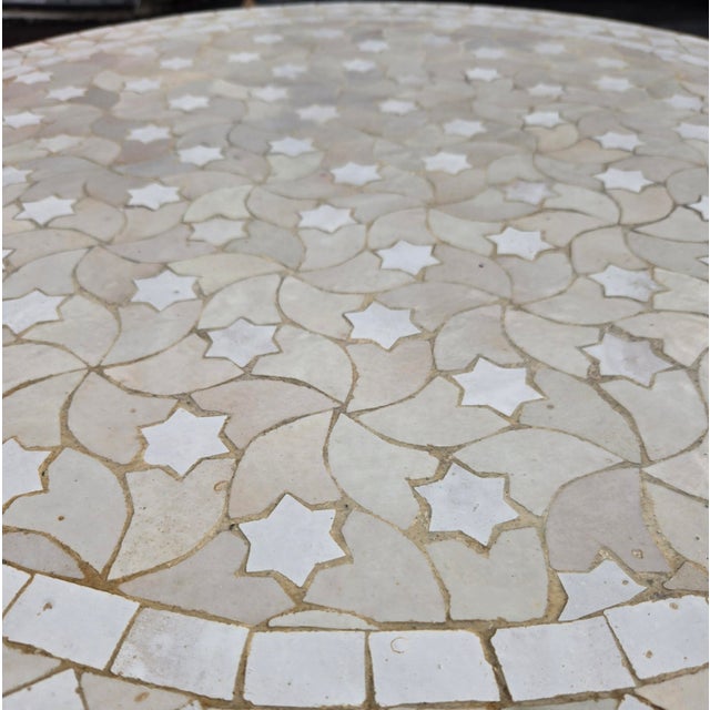 Beautiful handcrafted Moroccan mosaic table featuring an elegant beige and white color palette. Measuring 32 inches in...