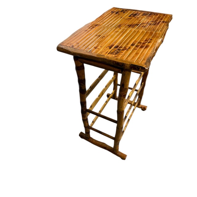 Vintage burnt bamboo wine rack serving table or side table. Perfect for small spaces Measures 20.5” w x 13.5” d x 27” h....