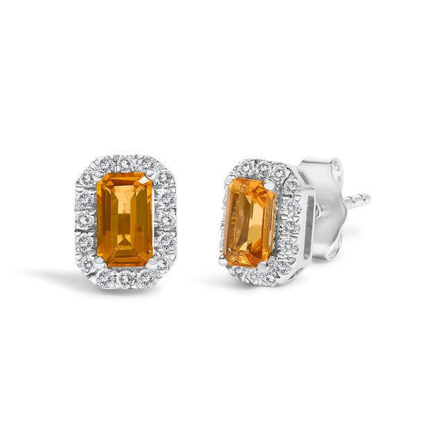 Envelop yourself in the luxury of these enchanting stud earrings, meticulously crafted from 10K white gold gold. At the...