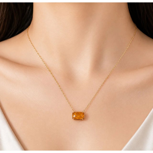 This exceptional antique brooch pin doubles as a pendant necklace, featuring a large natural Baltic Sea amber that...