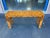 Striking vintage console table featuring richly figured burl wood veneer in a sleek waterfall silhouette. The elongated...
