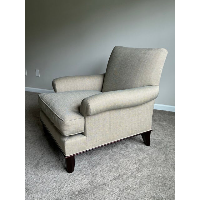 An exceptionally refined pair of Baker Furniture lounge chairs showcasing timeless transitional design, generous...