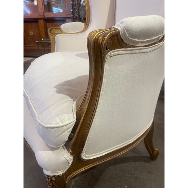 The Late 19th c French Louis XV Giltwood Bergere is a luxurious and stylish chair. With intricate gilt wood detailing and...