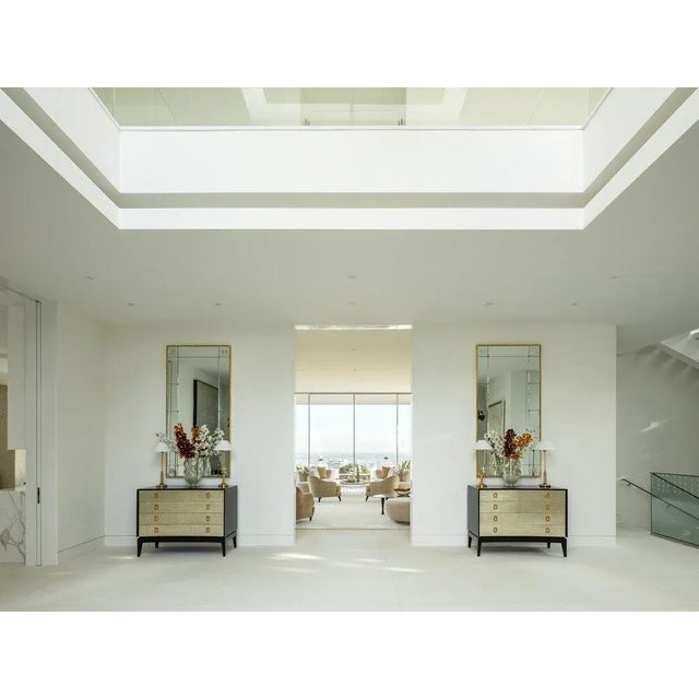 This pair of vintage Jens Risom Knoll chests were reimagined and refinished in ebony with 12k white gold leaf and P.E....