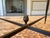 Elegant vintage Neoclassical coffee table in the manner of Maison Jansen, featuring a rectangular clear glass top set...