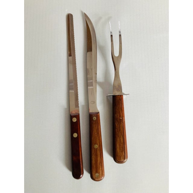Vintage set of 3 wood handle stainless carving set and bread knife , makers mark reads " Wear- Ever Made in USA" They are...