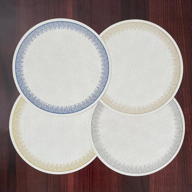 The Flare Silver Placemats - Set of 4 Sophisticated and elegant, our Flare placemats feature a beautiful embroidery work...