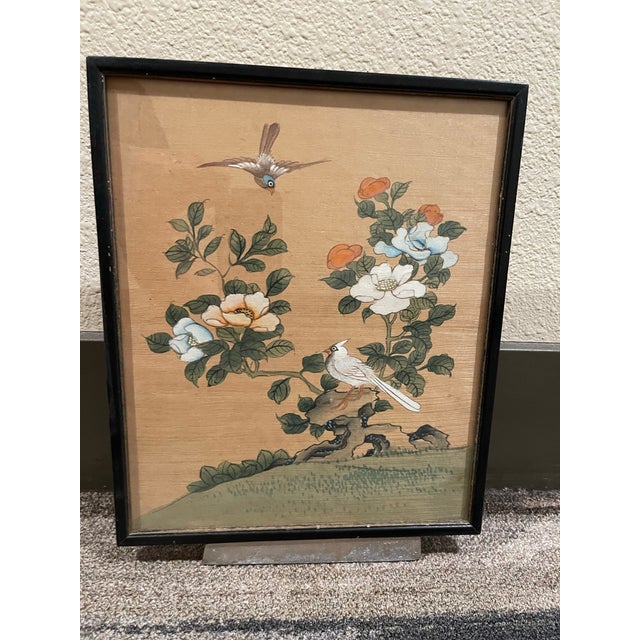 A lively vintage Chinese watercolor painting on silk, featuring a bird and peony blossoms. This artwork is a vintage...