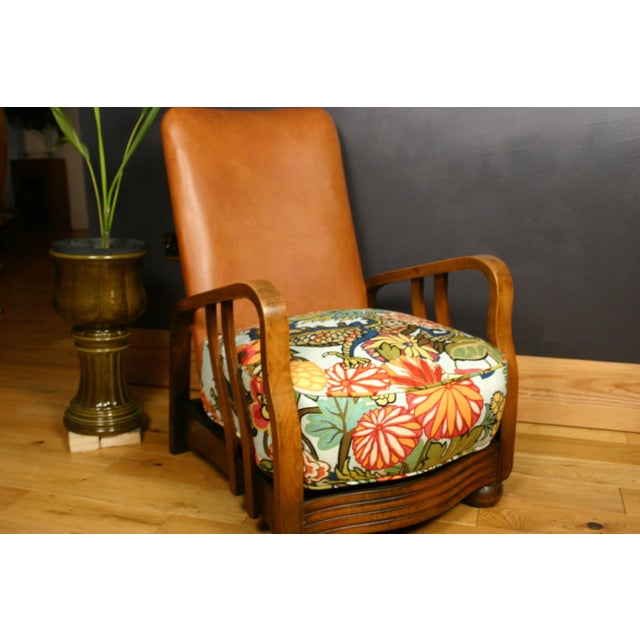 Original removable heavy sprung 1930s cushion reshaped and reupholstered - sits on wooden base of the chair.