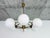A striking and elegant six-light Mid-Century Modern chandelier, manufactured in Czechoslovakia during the 1960s. This...