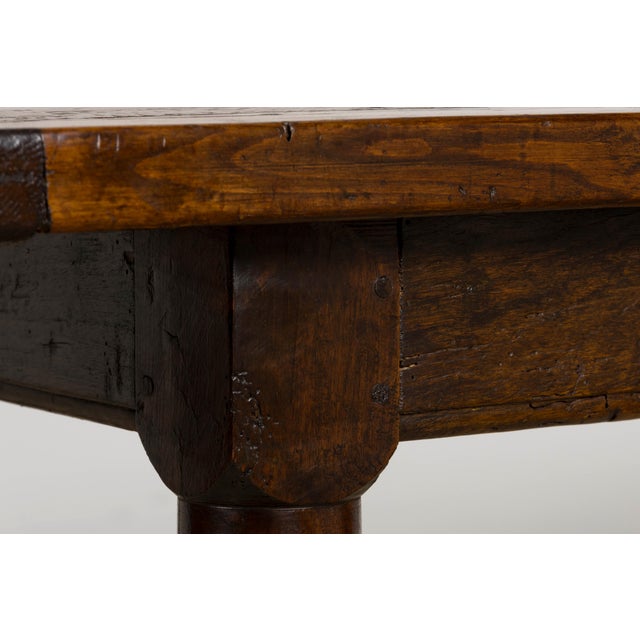 Sourced in Provence, France, this early 19th-century French oak dining table is crafted in the Louis XIII style,...