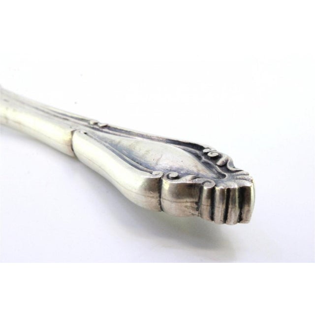 Cheese Knife with Silver Relief Handle and Monogram Card, in Very Good conditions. Designed before 1890 This piece has an...