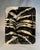 This shallow ceramic dish embodies a style often categorized as Graphic Organic Studio Art Pottery. It seamlessly merges...