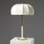 The shade is cream pleated fabric (in an umbrella shape, with full and soft texture to soften light), the lamp body...