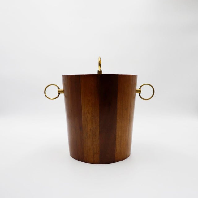 Circa 1950, we offer this mid-century Mexican modern ice bucket made in tropical woods. Recently restored.