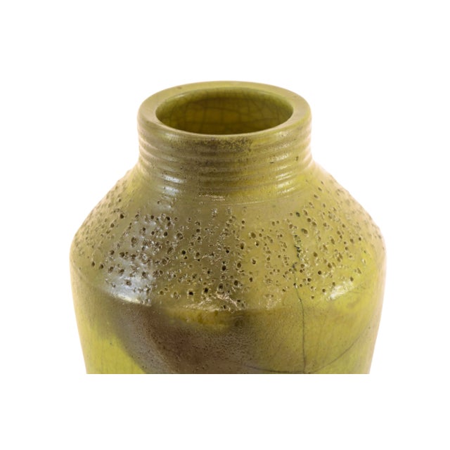 Vintage hand thrown black clay chartreuse yellow green studio art crackled glaze and textured vase with varied areas of of...