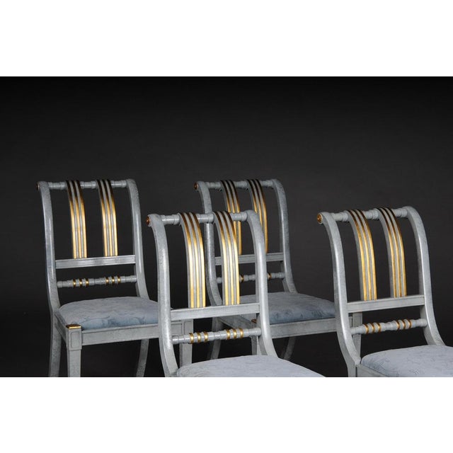 20th century set of 4 Italian designer chairs, wood. Solid wood frame, marbled, partly decorated with gold. Extremely...