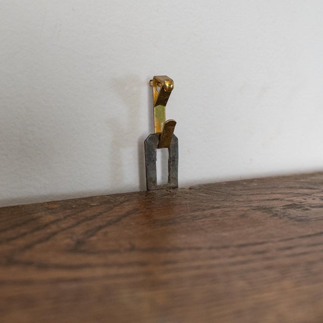 Striking 19th century Gothic Revival–influenced wall shelf crafted in solid oak. Featuring a paneled back, projecting top...