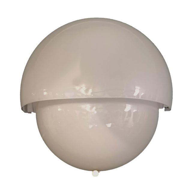 Vico Magistretti “Mania” wall sconce, Made in Italy, 1960s. Two opaline Murano glass shells, enameled metal frame and...